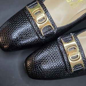 Salvatore Ferragamo Black Embossed Loafers with Gold Accents